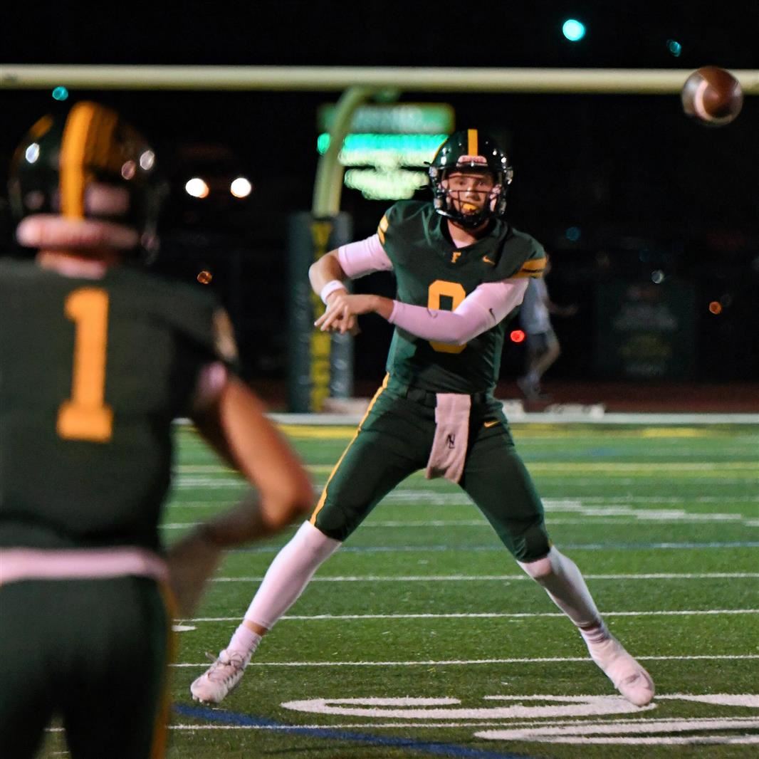 QB Johnny O'Brien throws a pass during a Fremd football game.   