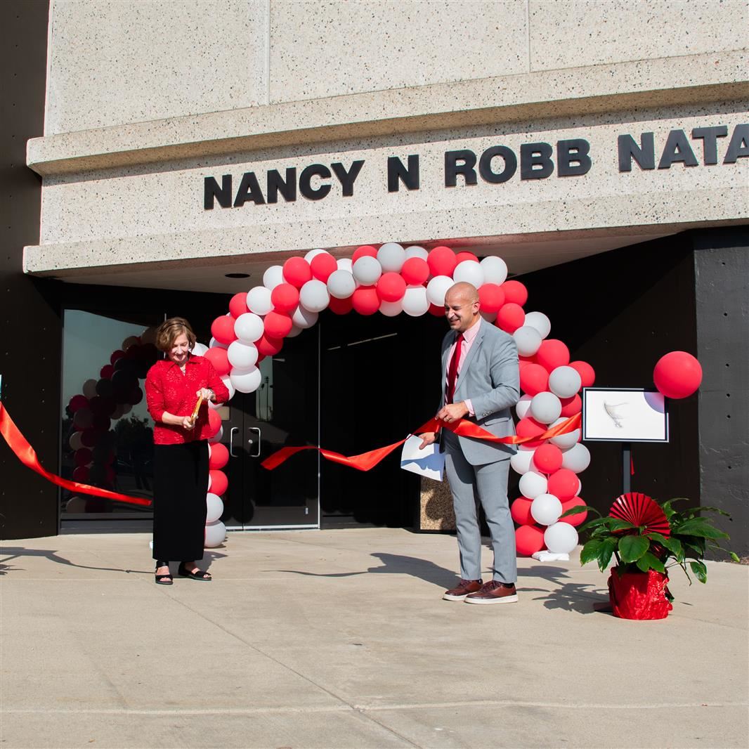  Dr. Nancy N. Robb cuts the ribbon on the school's Natatorium. 