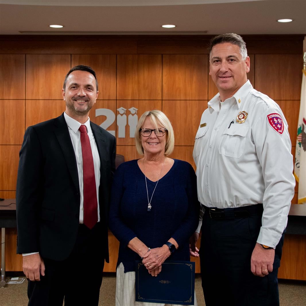 SHS Principal Tom Mocon, Becky McNamee, and Schaumburg Fire Chief Fabio Puccini