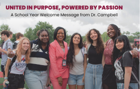  Dr. Campbell stands with students outside of Palatine High School.