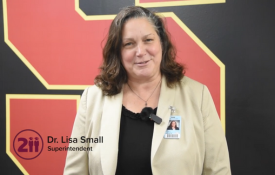  Lisa Small stands in front of an 'S' background at Schaumburg High.