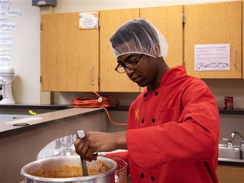 Junior Timothy Hutchen Mixes Soup
