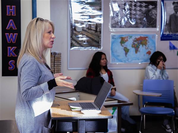 Instructor teaches students on the first day of second semester.