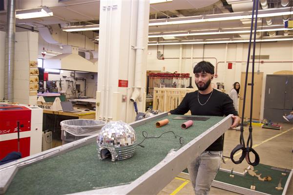 Woodworking students at Hoffman Estates built their own mini golf course, complete with the amenities we've all grown accustomed to at mini golf courses: like disco balls.